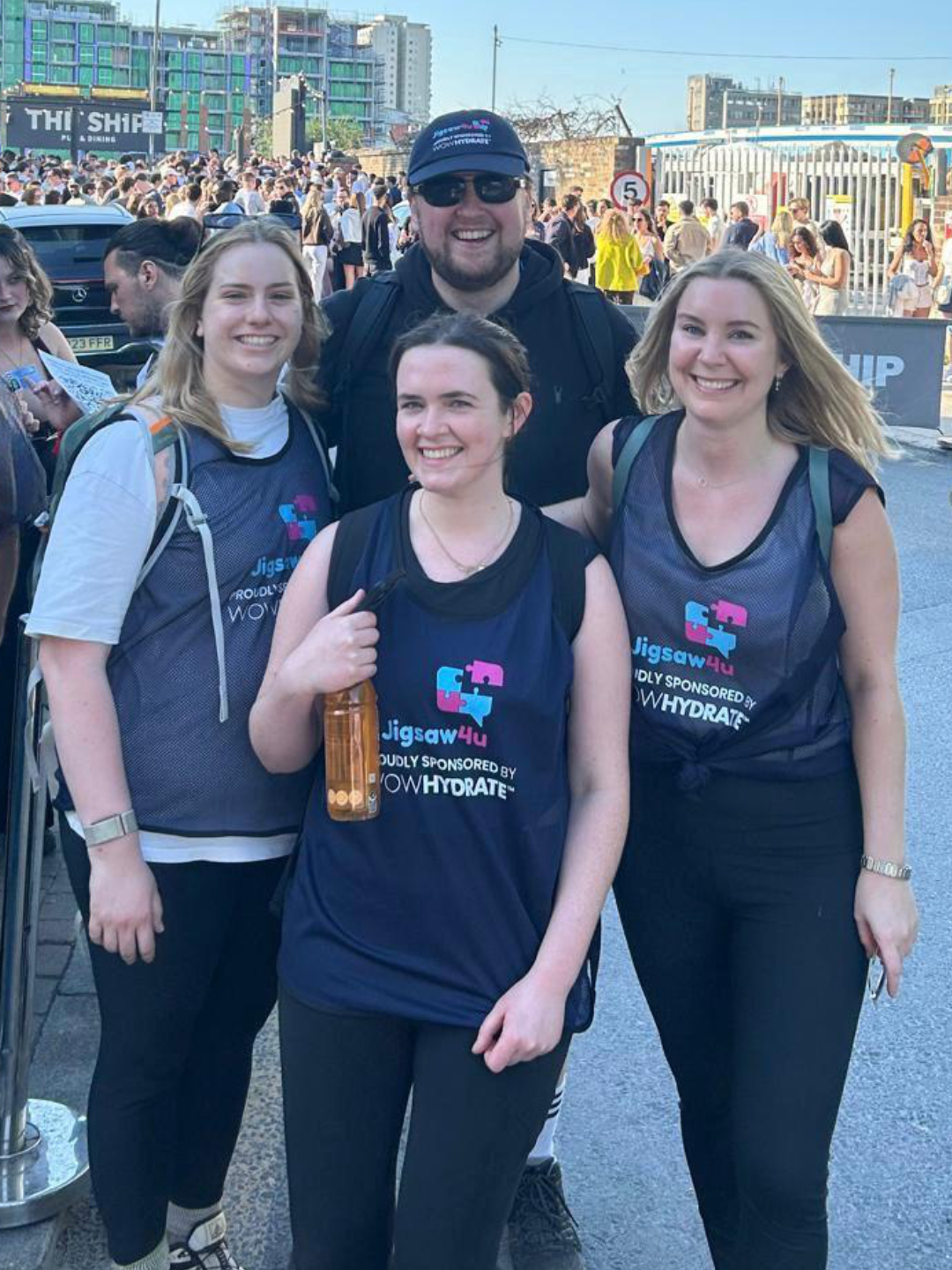 Macklin Doherty and walkers from CMS Law, at the Ship pub in Wandsworth at the very en of the SW London Bridge Walk with Jigsaw4u. One girl is holding WOW Hydrate bottle, sponsor of the walk.