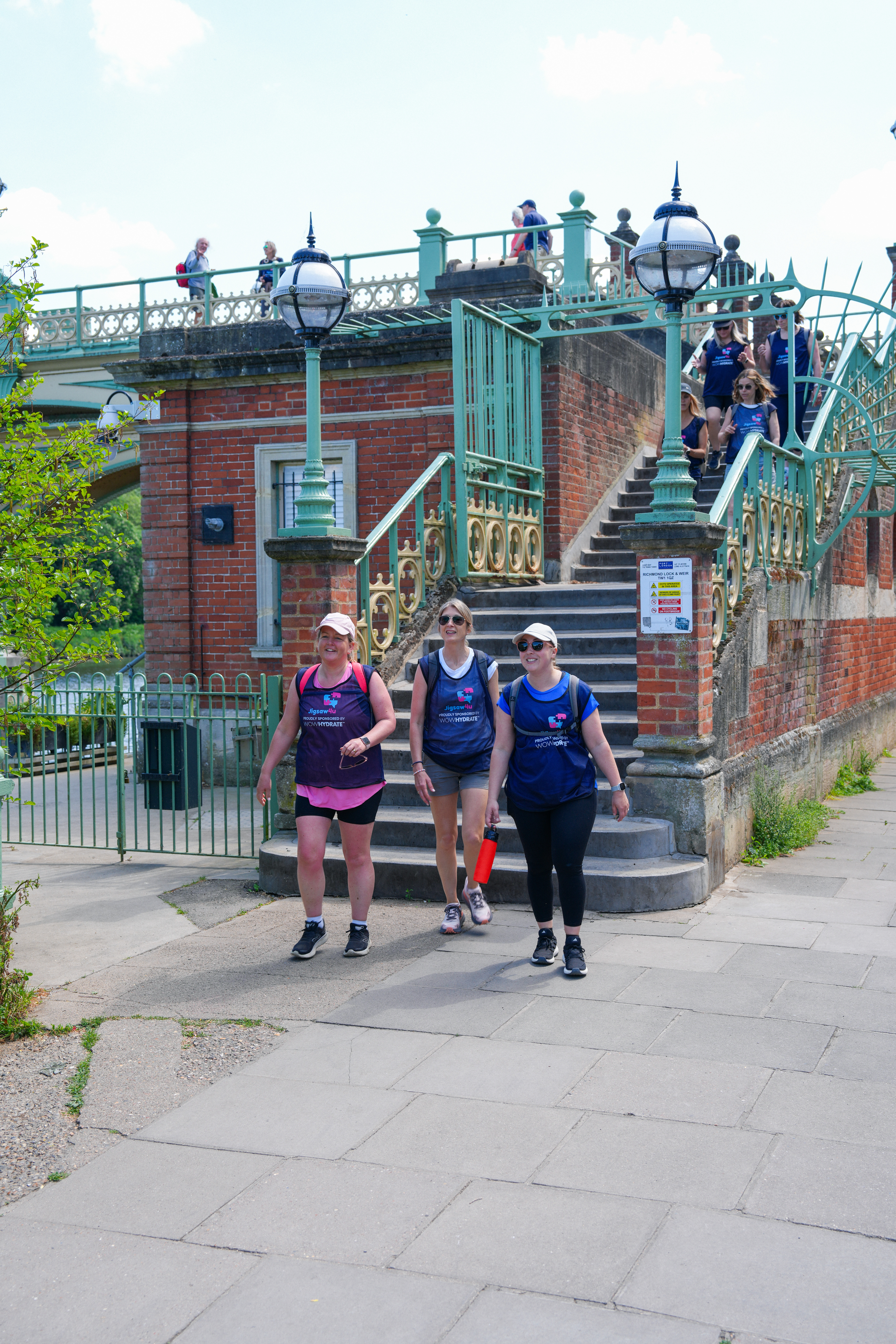 Three girls from the Gibsons Games team walking to the first rest stop at Richmond Lock and Footbridge. Including CEO, Kate Gibson.
