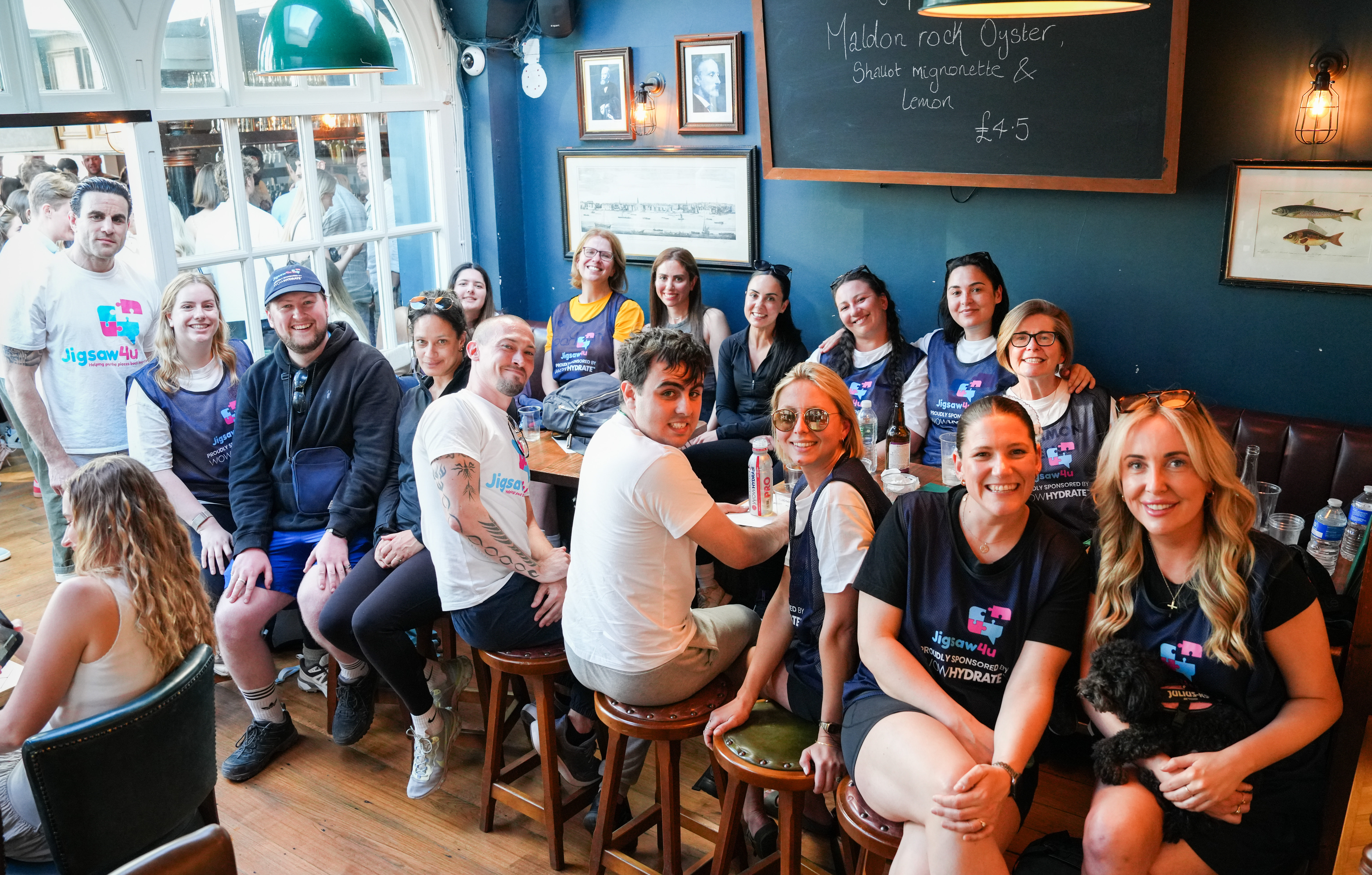 Group of walkers at the SW London Bridge Walk at the Ship pub in Wandsworth near to the end of the walk. Wearing Jigsaw4u shirts and bibs, sponsored by WOW Hydrate