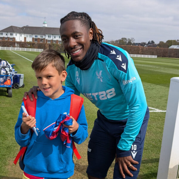Boy service-user with Eze football player for Crystal Palace FC at their training ground, offered Activities4u event from CPSCC (Crystal Palace Supporters Children's Charity).